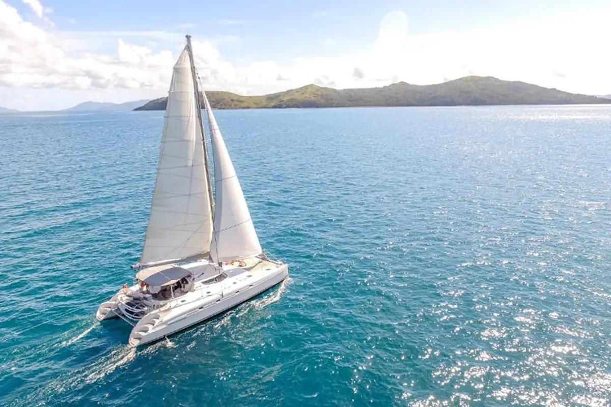 Sailing Catamaran ONice cruising through the Whitsunday Islands near Airlie Beach Queensland