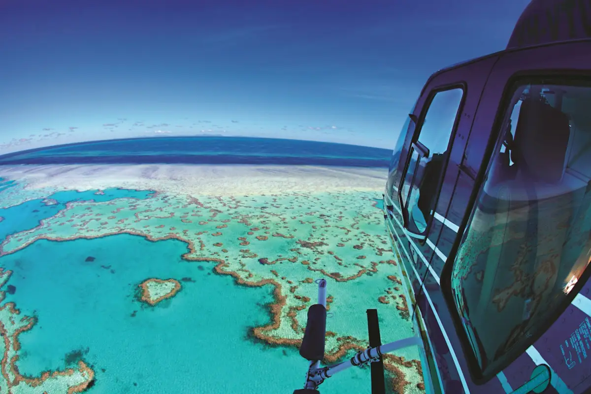 Dundee Adventure Travel | HeliReef | Scenic Flights – Airlie Beach HeliReef Scenic Flight Airlie Beach, Whitsundays helicopter tour, Heart Reef flight, Whitehaven Beach aerial view