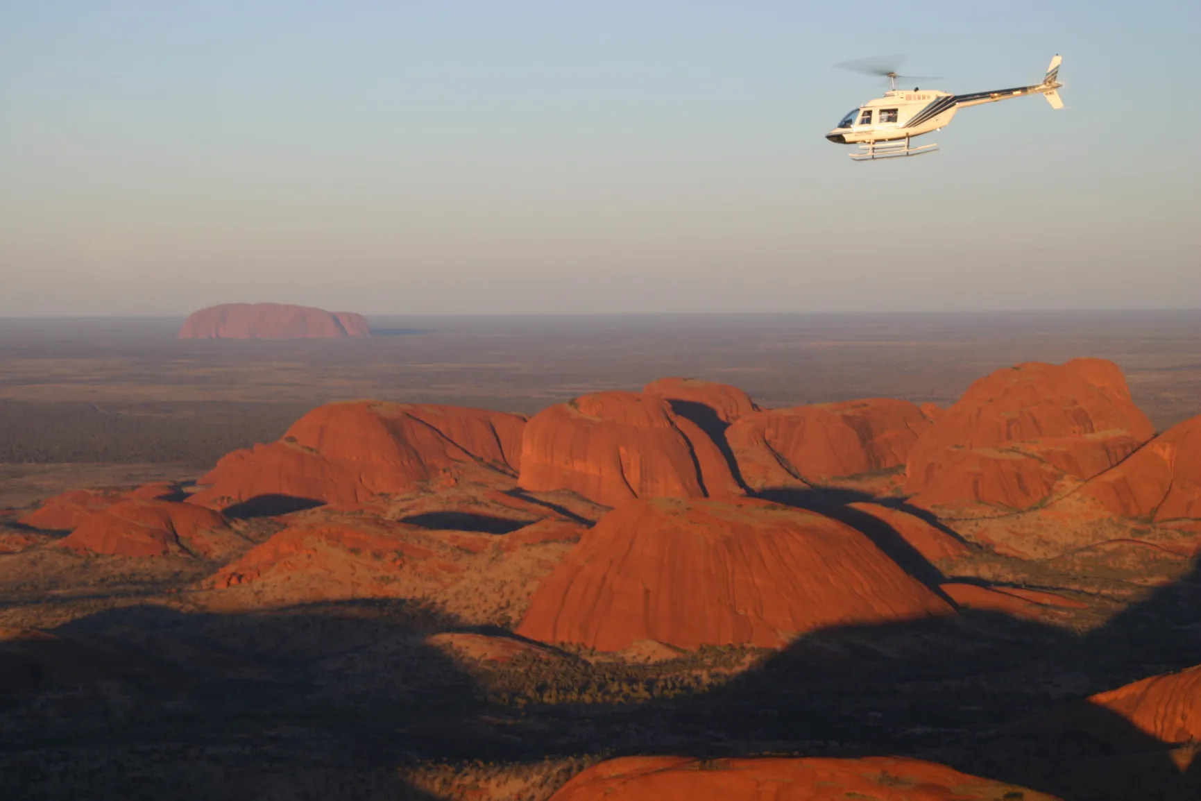 uluru rock blast helicopter flight aerial view