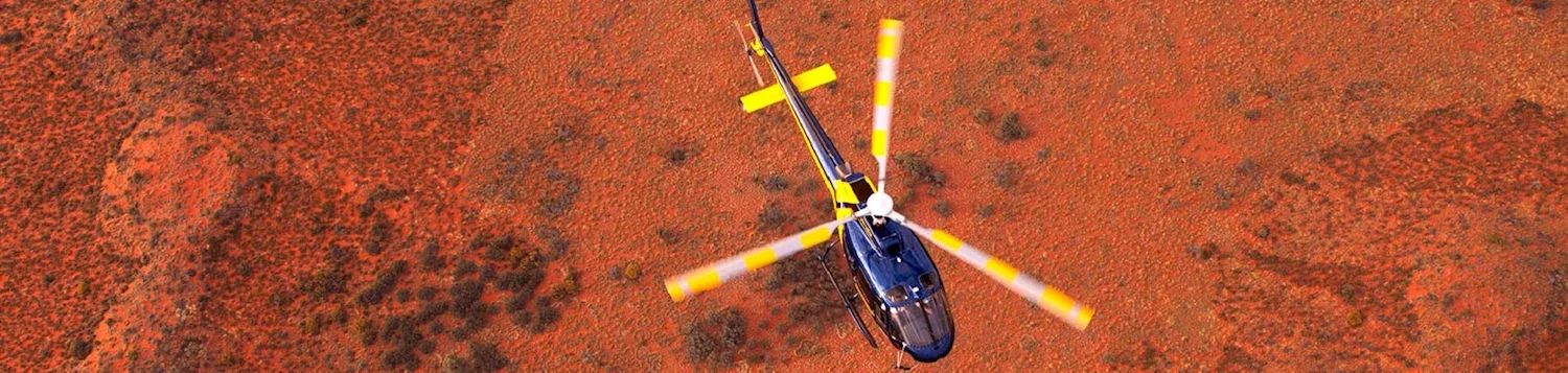 helicopter flight red centre australia sunset