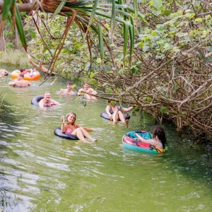 Travellers floating on tubes through Eli Creek on K’gari Fraser Island