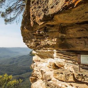 Couple enjoying views from Honeymoon Bridge overlooking the Jamison Valley along the Three Sisters Walking Trail, Katoomba.