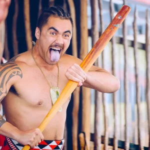 Dundee Adventure Travel | NZ Adventure – Auckland to Queenstown (17 Day) Rotorua, New Zealand -December-11-2017 : Maori tribes traditional war cry. The Maori are the indigenous Polynesian people of New Zealand.