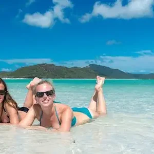 Two women along Whitehaven Beach during Siska Fun Sailing Whitsundays trip