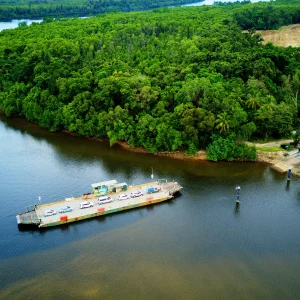 Coach crossing the Daintree River ferry in Tropical North Queensland