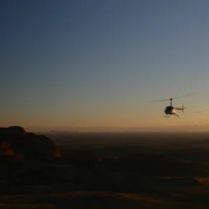 aerial shadow of Uluru from helicopter