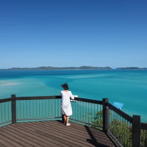 Traveller at Hill Inlet Lookout overlooking swirling sands at Whitehaven Beach in the Whitsundays
