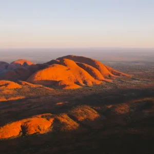 Helicopter flight over Uluru at sunrise