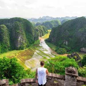 Vietnam Intro 12 days tour travellers cycling through Ninh Binh rice fields
