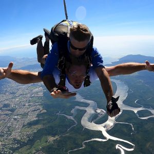 Tandem skydiver descending