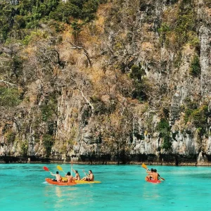 Enjoy kayaking on the waters of Phi Phi Island during the Thailand and Vietnam Intro tour