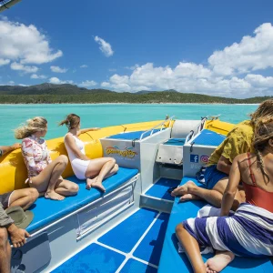 Family enjoying snorkelling near Hamilton Island