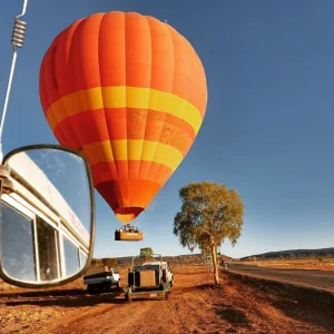 Hot air balloon landing in the desert
