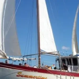 Guests relaxing on deck during Summertime Sailing Whitsundays Adventures